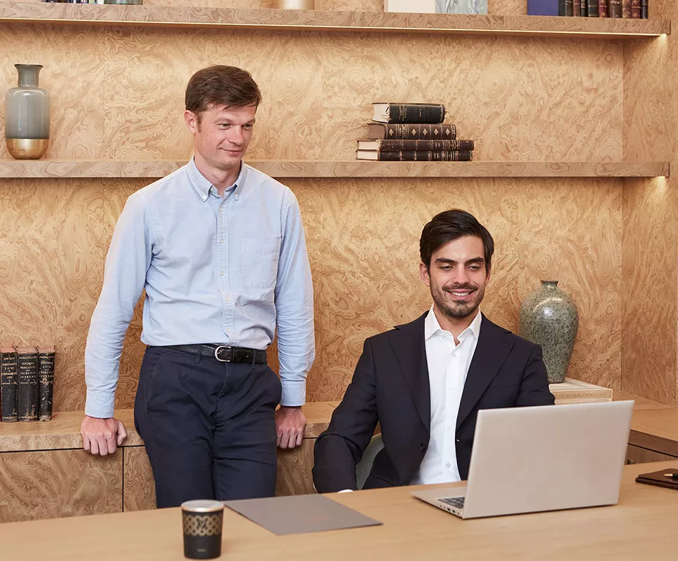 Consultants receiving training in front of a screen
