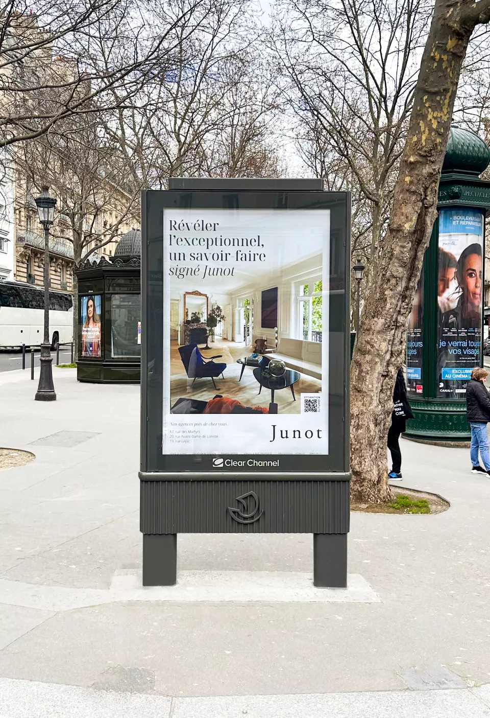 Advertising panel promoting Maison Junot in the streets of Paris